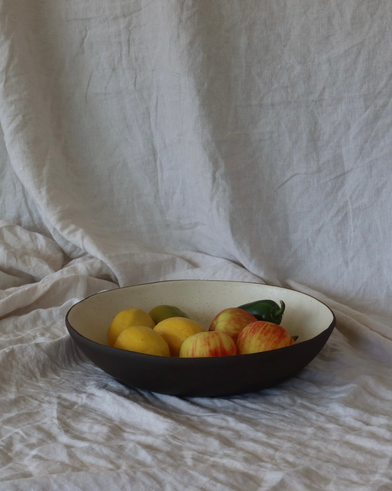 Handmade ceramic bowl with fruit